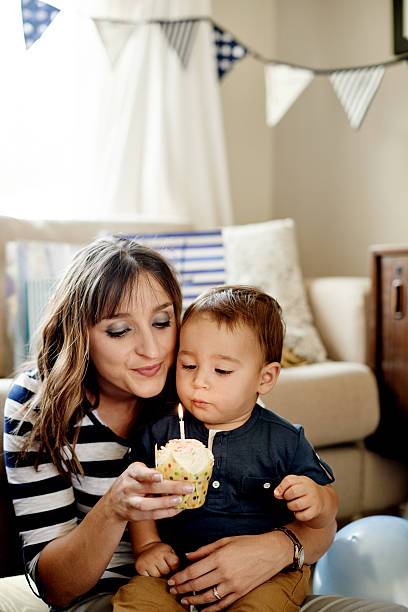 istock Blowing out his first birthday candle 529424904