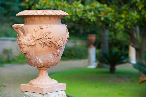 Close-up view of a terracotta vase and its handmade decoration in the public gardens of Caltagirone
