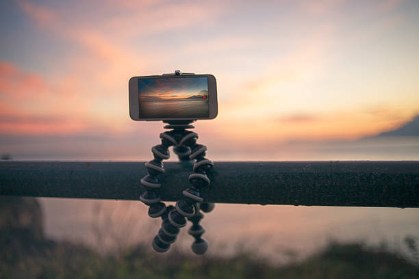 istock Phone in tripod and landscape 529434385