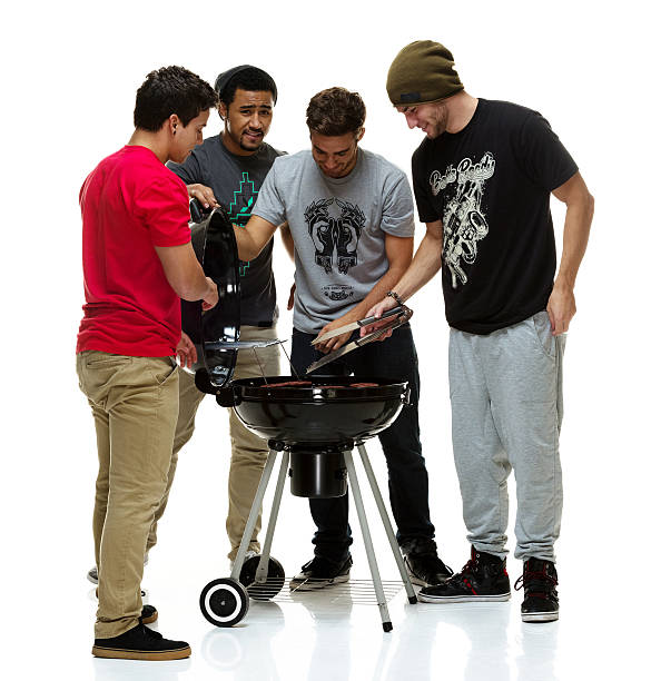 istock Social group of young men having a BBQ 529436581