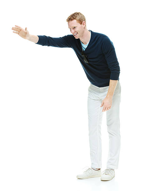 istock Happy man standing and waving 529436587