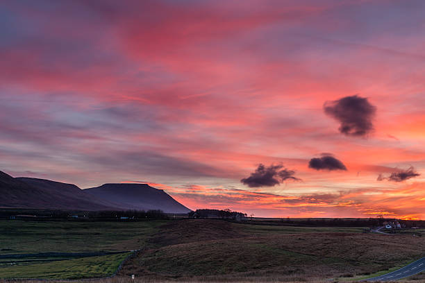 Ingleborough at sunset Ingleborough is the second highest mountain in the Yorkshire Dales and is one of the Yorkshire Three Peaks ingleborough stock pictures, royalty-free photos & images