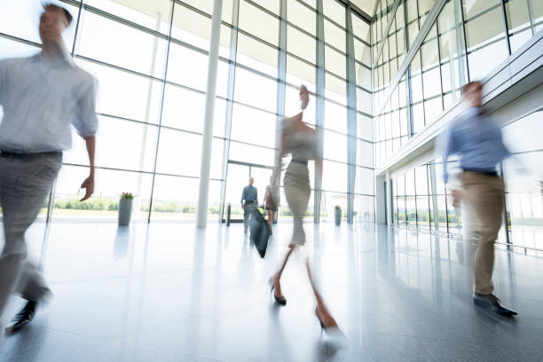 istock Abstract business image of people walking in modern building 529437055