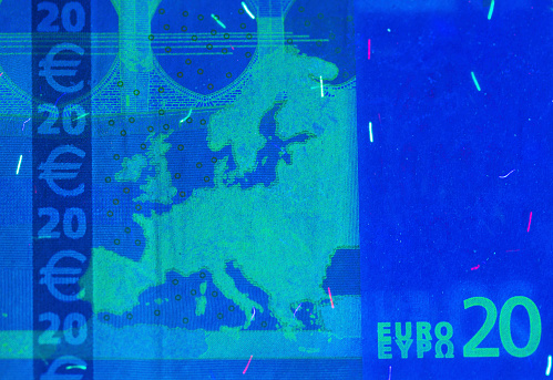 twenty euro banknote under ultra-violet light