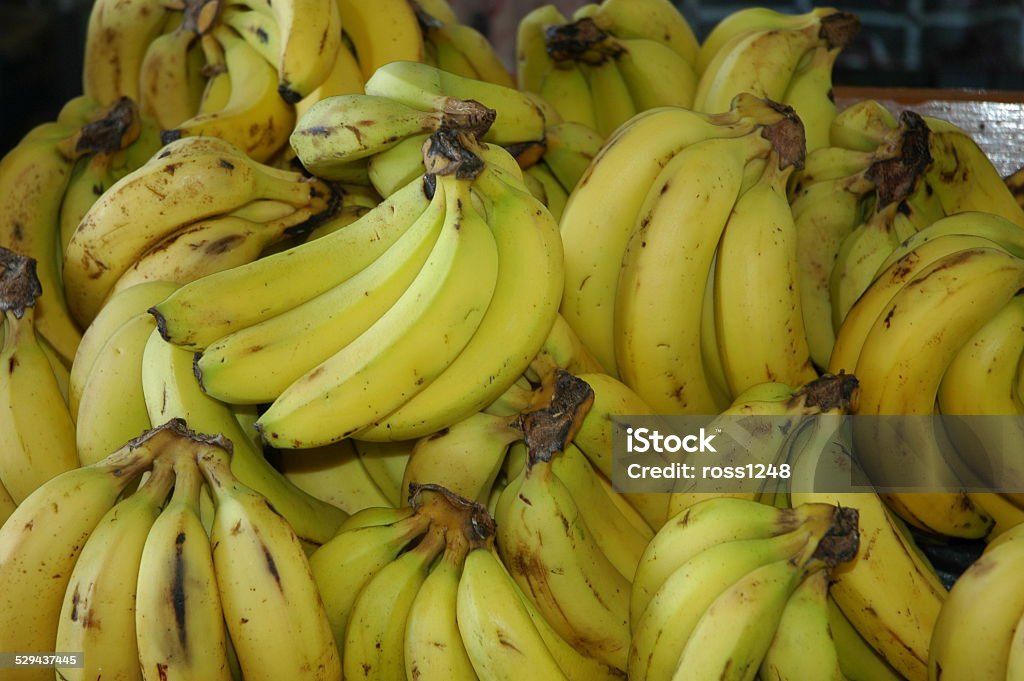 Bananas A pile of bananas on a market stall in Port of Spain, trinidad and Tobago Agriculture Stock Photo