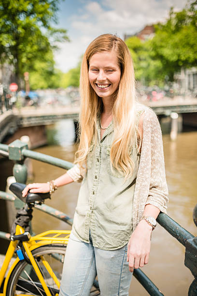 istock Dutch woman with bicycle in amsterdam 529438781