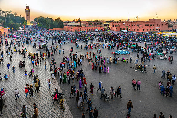 Famous Djemaa El Fna Square in early evening light, Marrakech, Morocco with the Koutoubia Mosque, Northern Africa.Nikon D3x