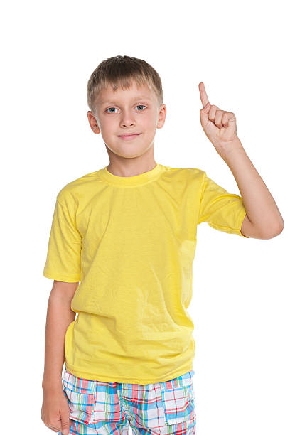istock Smiling young boy shows his finger up 529440141