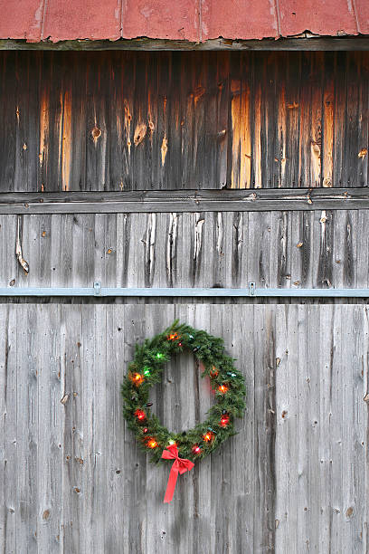 istock Christmas wreath on barn 529440333