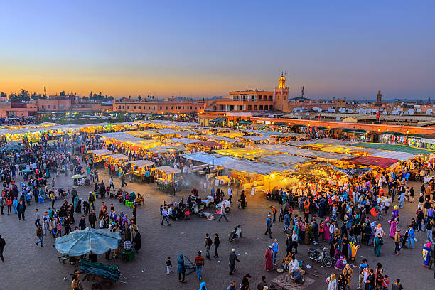 Evening Djemaa El Fna Square with Koutoubia Mosque, Marrakech, Morocco stock photo