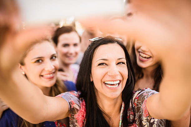 istock Group of college student laughing and doing a selfie 529457569
