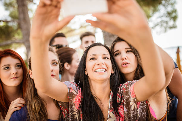 istock Group of college student laughing and doing a selfie 529457573