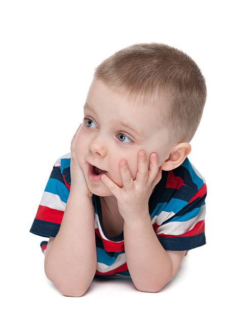 istock Surprised little boy on the white background 529458379