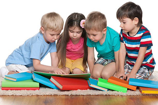istock Children with books on the floor 529458711