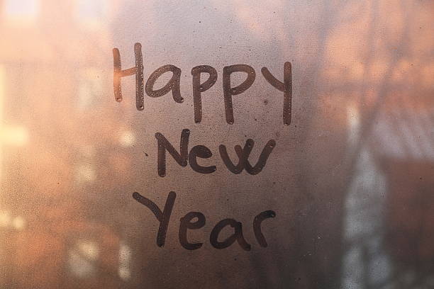 istock Happy New Year text written on the glass 529459147