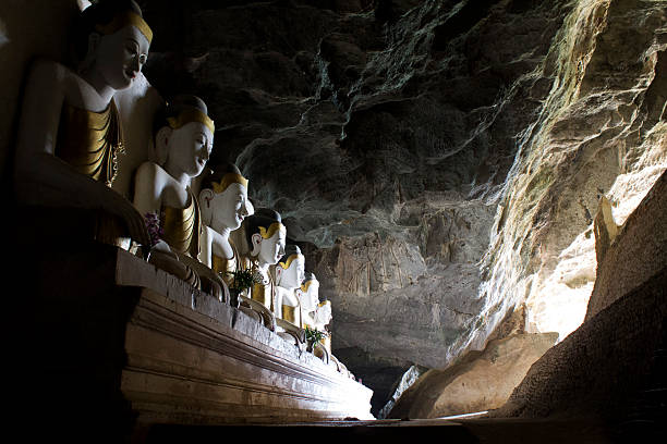 Golden Buddhists in cave