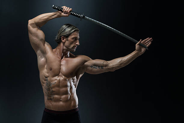 istock Muscled Male Model In Studio With A Sword 529461987