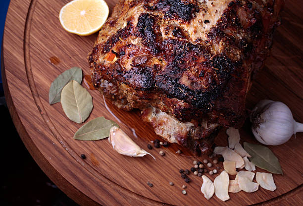 istock Roasted meat on wooden cutting board closeup 529462029