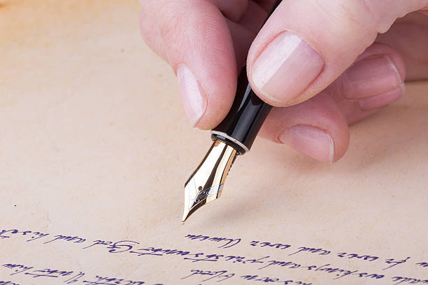 istock Hand writing with old fountain pen manuscript 529462541