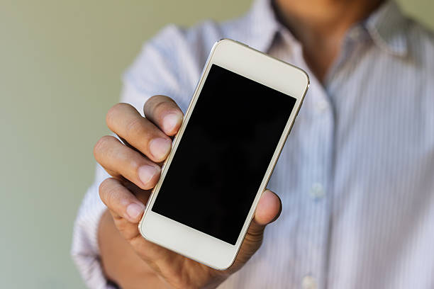 istock man show his smart phone 529477629