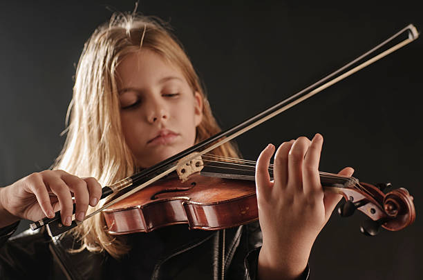istock Girl with violin 529479717