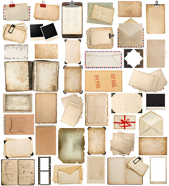 istock aged paper, books, pages and old postcards isolated on white 529480807
