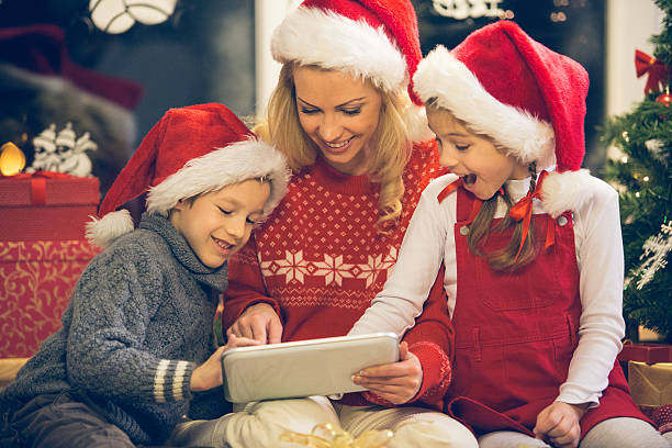 istock Christmas family with digital tablet 529481443