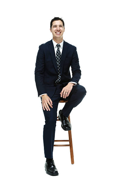 istock Cheerful businessman on stool & looking at camera 529482457