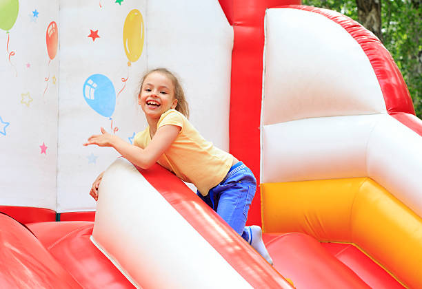 istock Joyful little girl playing on a trampoline. 529482677