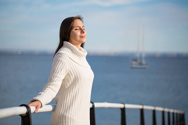 istock natural young latin woman on beach 529483405