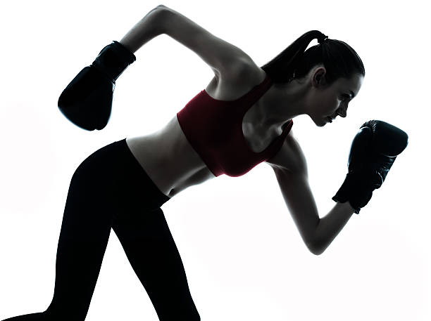 istock beautiful woman exercising boxe silhouette 529483615