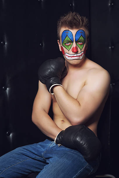 istock Young man in clown makeup 529484147