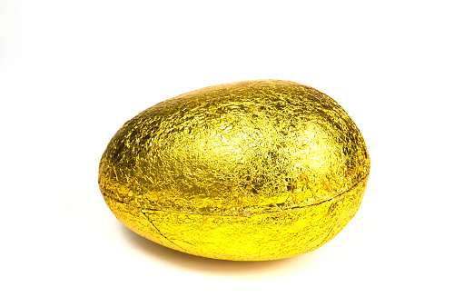 Golden easter egg isolated on white