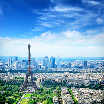 Aerial view of Paris with Champ-de-Mars, Eiffel Tower and skyscrapers of La Defense. Composite photo