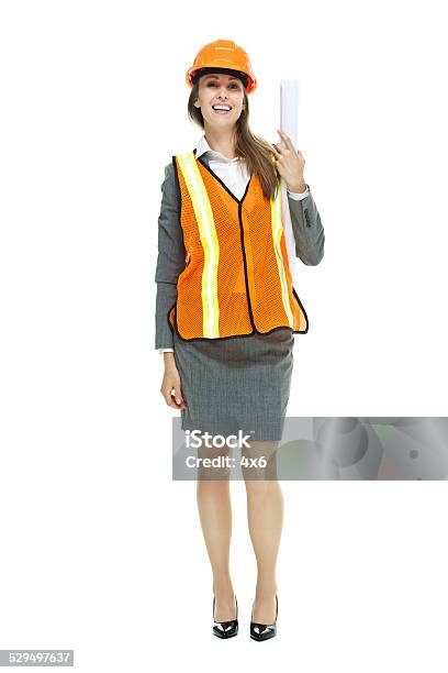 Smiling Architect Holding Blueprint Stock Photo - Download Image Now - 30-39 Years, Adult, Adults Only