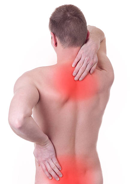 istock man suffers from pain in the spine 529497993