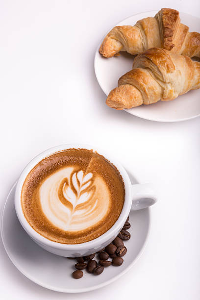 istock Croissant with a cup of latte 529498447