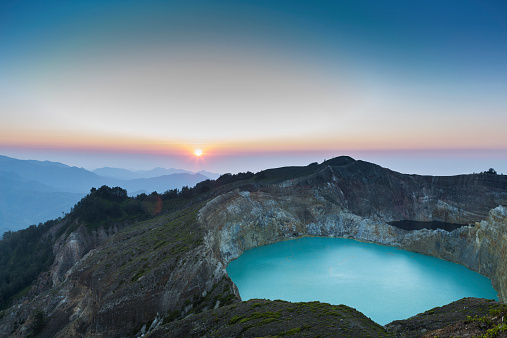Iconic sunrise over the volcano Kelimutu on the island of Flores in Indonesia.