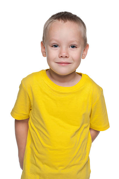 istock Blond little boy in a yellow shirt 529500095