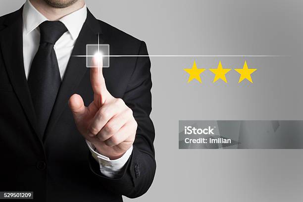 Businessman Pushing Button Three Rating Stars Stock Photo - Download Image Now - Adult, Advertisement, Agreement