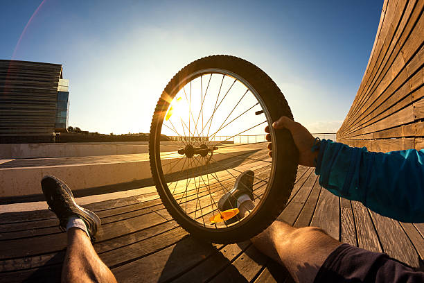 istock mountain bike wheel in hand 529516287