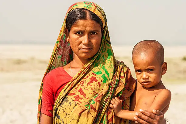 Mother and young child pictured on a char island in the Jamuna River, north-western Bangladesh.