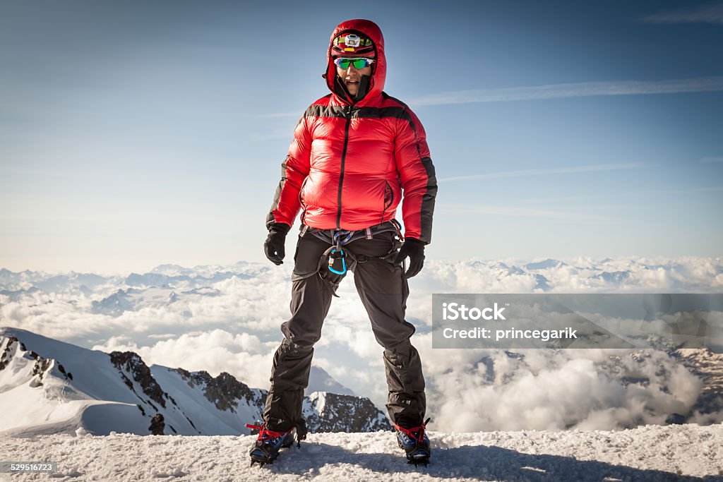 Climber on the summit of Mont Blanc Climber on the highest point of the Alps - Mont Blanc Carabiner Stock Photo