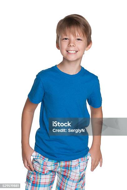 Laughing Young Boy In A Blue Shirt Stock Photo - Download Image Now - Arts Culture and Entertainment, Beautiful People, Blue