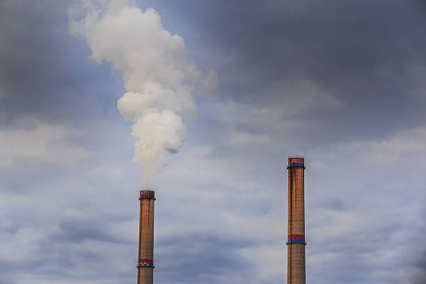 istock Industrial scenery with smoke from coal powered plant 529520155