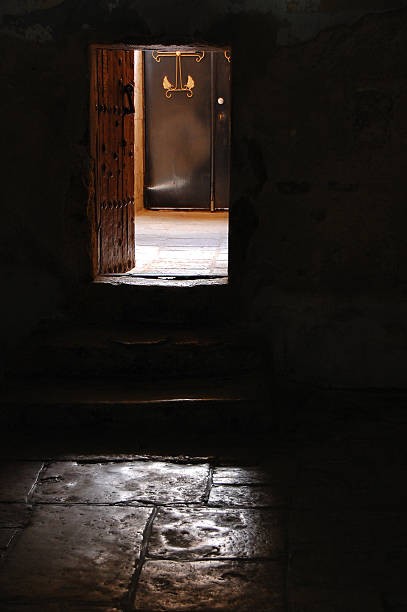istock mystic view of open door with sunlight 529520317
