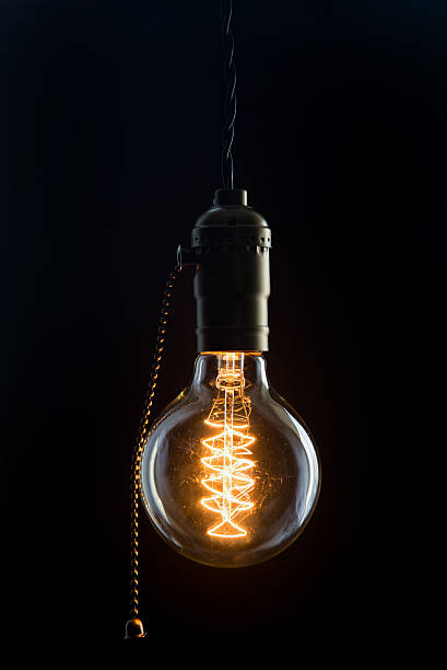 Vintage incandescent Edison type bulb Vintage incandescent Edison type bulb light bulb filament photos stock pictures, royalty-free photos & images