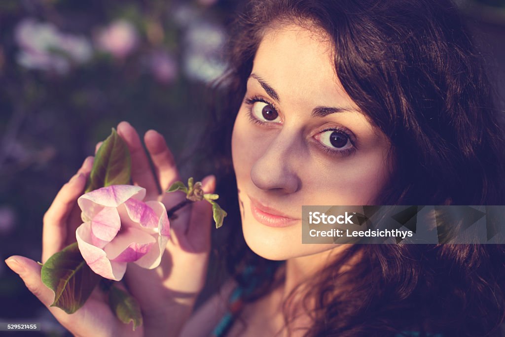 Woman with magnolia Woman on the garden Adult Stock Photo