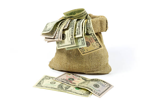 istock Money in Jute Bag Isolated on White 529522207