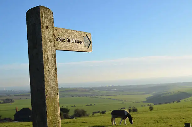 Public bridleway sign on the Sussex Southdowns in England. Image shot in mid December using Nikon D5100 and prime lens.